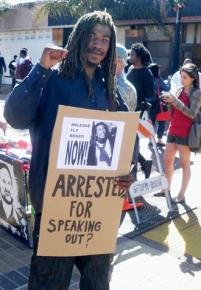 Fly Benzo joins in a rally in his defense