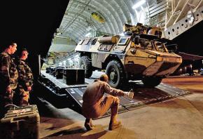 French forces unload an armored vehicle at Mali's main airport in Bamako